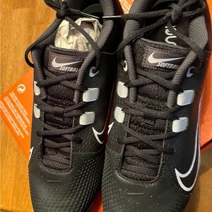 Nike Black and White Athletic cleats with Reflective Accents